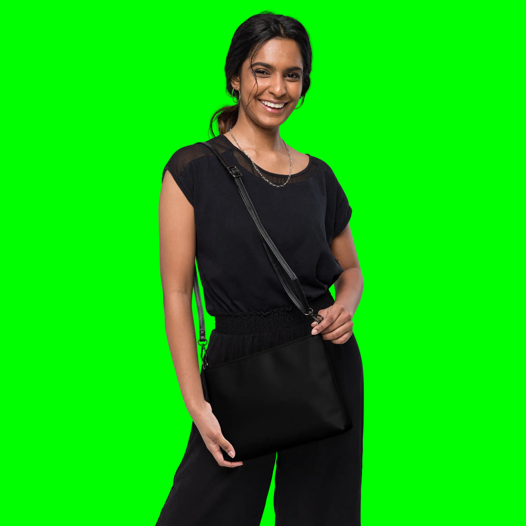 Blessed & Grateful® black faux-leather crossbody bag with white logo print, adjustable strap — back view
