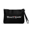 Blessed & Grateful® black faux-leather crossbody bag with white logo print, adjustable strap — front view